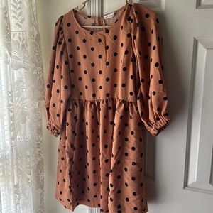 Rusty orange with black polka dots